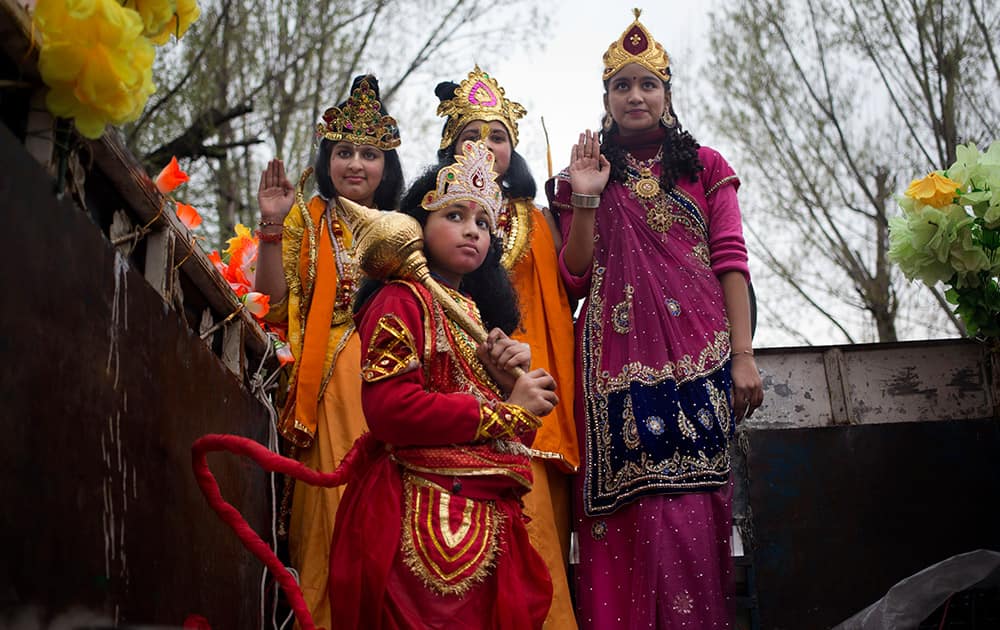 Kashmiri Hindu children, dressed as Hindu gods, participate in a procession on Ram Navami festival in Srinagar.