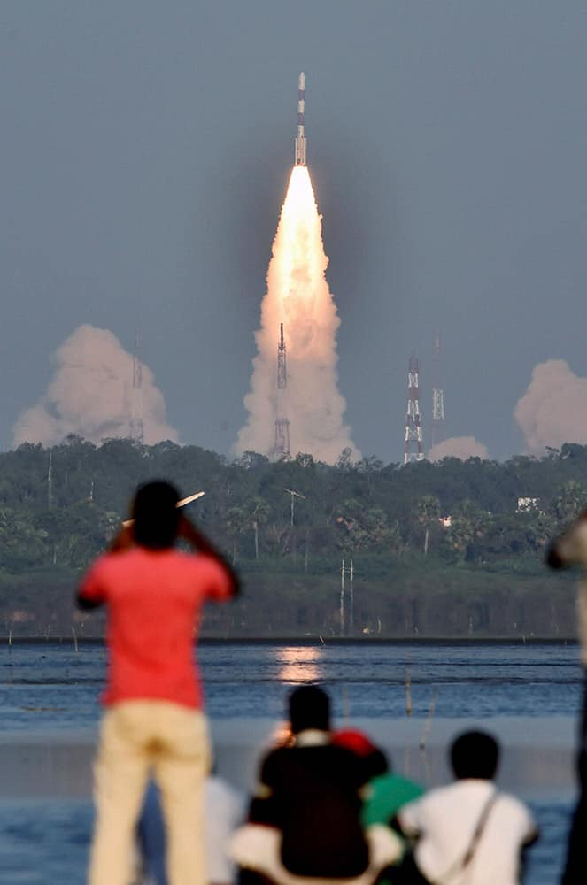 Indian Space Research Organisation’s Polar Satellite Launch Vehicle (PSLV-C27) carrying Indias fourth navigation satellite IRNSS-1D, lifts off from Satish Dhawan Space Center in Sriharikota.