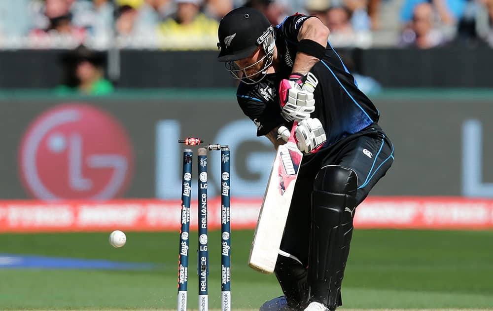 New Zealand captain Brendon McCullum is bowled for no score by Australia's Mitchell Starc during the Cricket World Cup final in Melbourne, Australia.