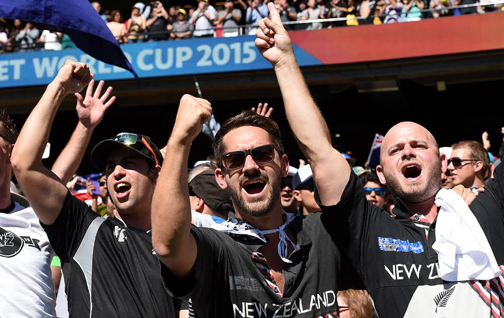 New Zealand fans cheer on their team during the Cricket World Cup final against Australia in Melbourne, Australia.