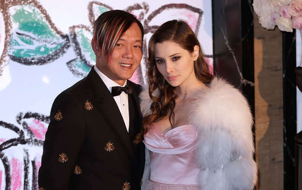 Chinese businessman Stephen Hung and his wife Deborah pose for photographers as they arrive at the Rose Ball in Monaco. The Rose Ball is the traditional annual charity event in the Principality of Monaco.