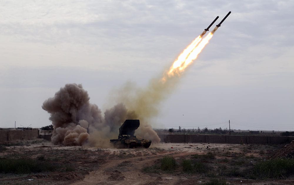 Iraqi security forces launch rockets against Islamic State extremist positions in Tikrit, 130 kilometers (80 miles) north of Baghdad, Iraq.