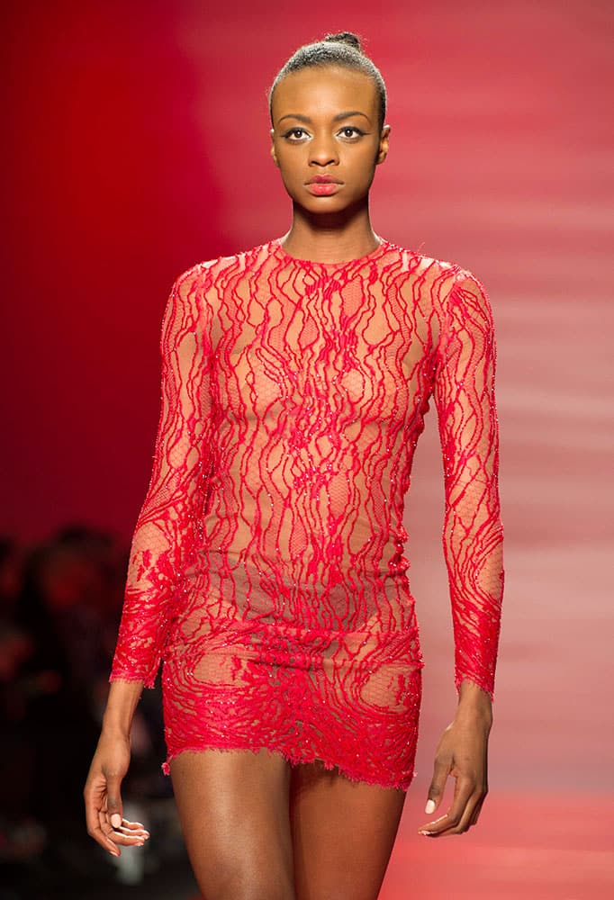 A model walks the runway in the Mikael D Fall 2015 show during Toronto fashion week.