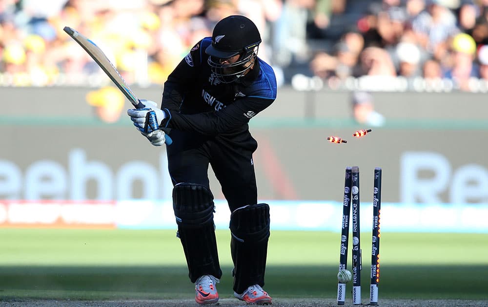 New Zealand’s Dan Vettori is bowled out for nine runs while batting against Australia during the Cricket World Cup final in Melbourne, Australia.