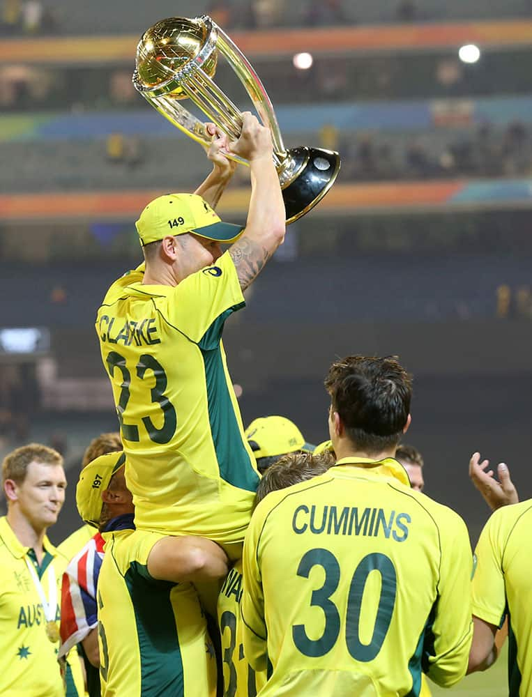 Australian captain Michael Clarke is held aloft by teammates as he celebrates their seven wicket victory over New Zealand to win the Cricket World Cup final in Melbourne, Australia.