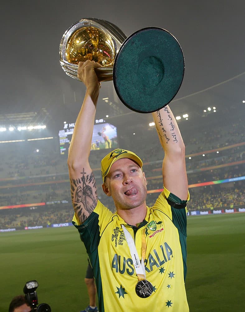 Australian captain Michael Clarke holds the trophy aloft as he celebrates their seven wicket victory over New Zealand to win the Cricket World Cup final in Melbourne, Australia.