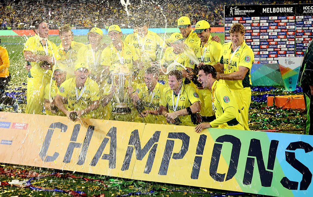 The Australian team spray champagne as they celebrate their seven wicket win over New Zealand in the Cricket World Cup final in Melbourne, Australia.