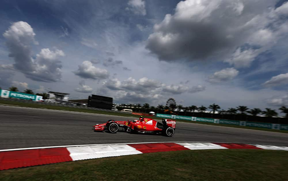 Ferrari driver Kimi Raikkonen of Finland steers his car during the Malaysian Formula One Grand Prix at Sepang International Circuit in Sepang, Malaysia.