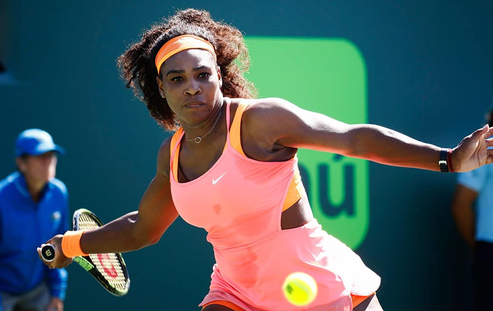 Serena Williams returns the ball to CiCi Bellis at the Miami Open tennis tournament in Key Biscayne, Fla.