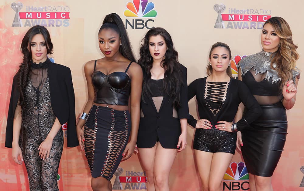 Camila Cabello, from left, Normani Kordei, Lauren Jauregui, Ally Brooke Hernandez and Dinah Jane Hansen, of Fifth Harmony, arrive at the iHeartRadio Music Awards at The Shrine Auditorium, in Los Angeles. 