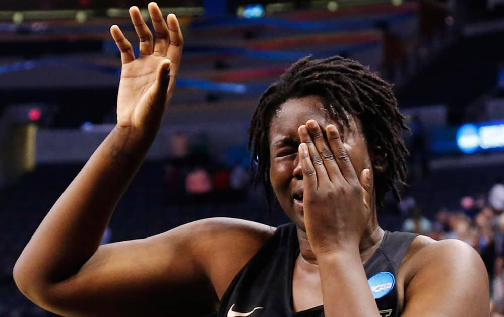 Baylor forward Sune Agbuke cries after Baylor's 77-68 loss to Notre Dame during a regional final in the NCAA women's college basketball tournament, in Oklahoma City. 