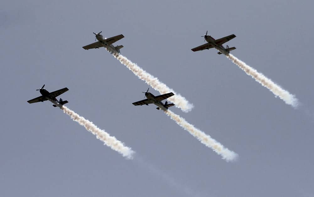 Aircrafts of 'The Global Stars' team of British Aerobatics Champions perform during rehearsals on the eve of the Gujarat Aero Conclave 2015 in Ahmedabad.