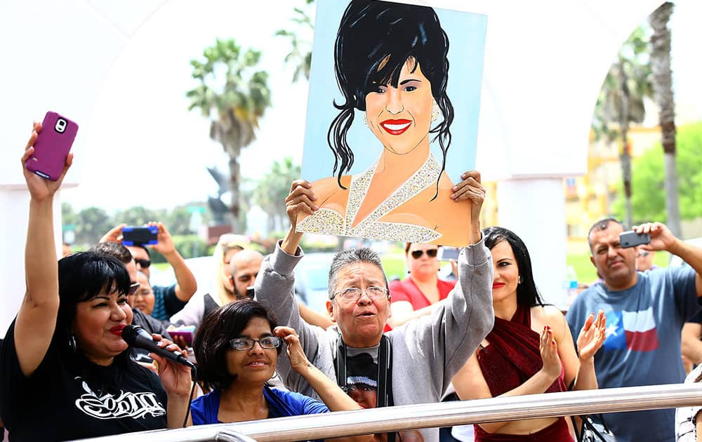 Fans gather in front of the Selena Memorial Statue in Corpus Christi, Texas, to remember the Latin pop star on the 20th anniversary of her death.