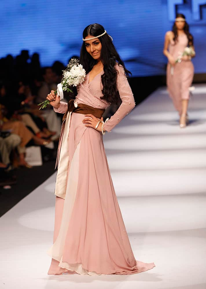 Models present creations by Pakistani designer Madiha Raza at Fashion Pakistan Week 2015.