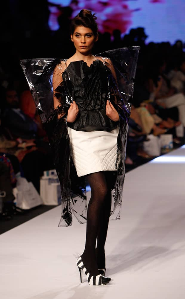 A model presents creations by a Pakistani group of fashion student at Fashion Pakistan Week 2015.