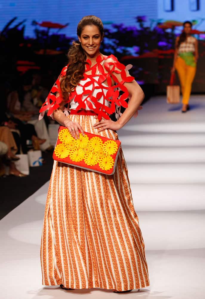 Models present creations by Pakistani designer Madiha Raza at Fashion Pakistan Week 2015.