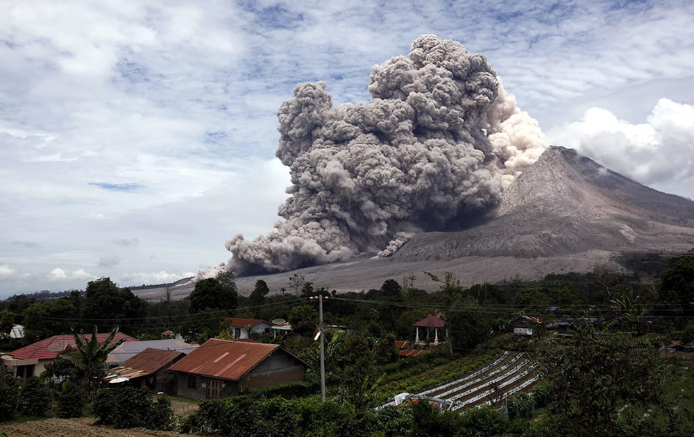 Mount Sinabung releases pyroclastic flows seen from Tiga Serangkai, North Sumatra, Indonesia.