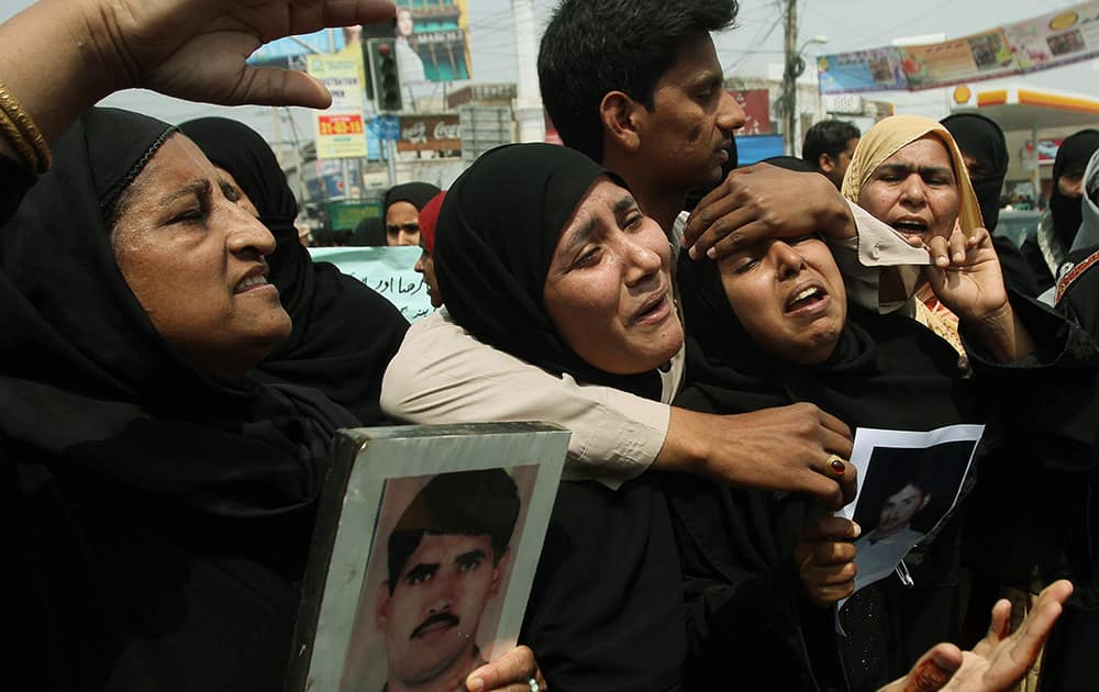 Family members of stranded Pakistanis in Yemen protest to demand their return, as they gather in Multan, Pakistan.