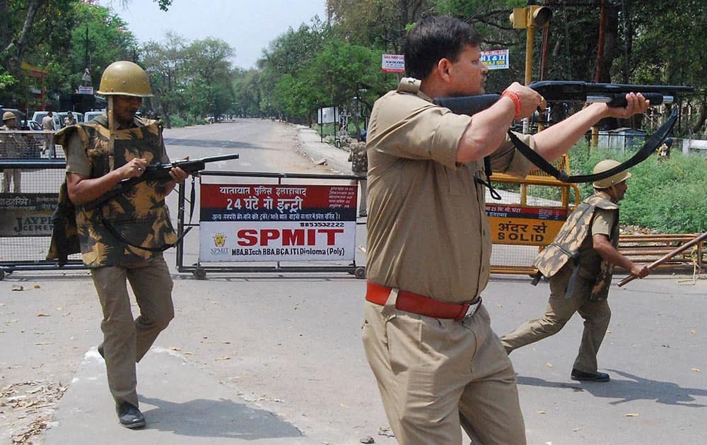 Policemen open fire on students during the protest against leaked question paper of UP PCS (pre)-2015 in Allahabad.