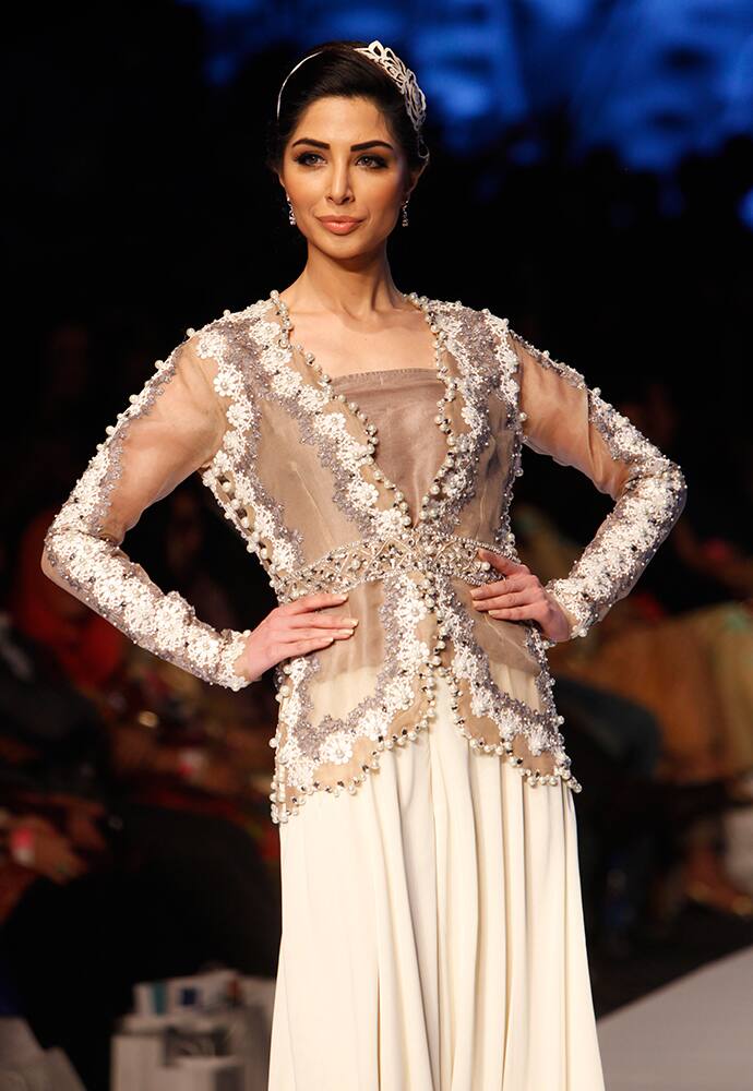 A model presents creations by Pakistani designer Nida Azwer at Fashion Pakistan Week 2015, in Karachi, Pakistan.