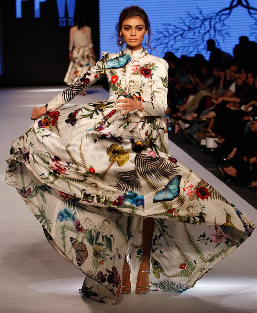 Models present creations by Pakistani designer Zaheer Abbas at Pakistan Fashion Week 2015, in Karachi, Pakistan.