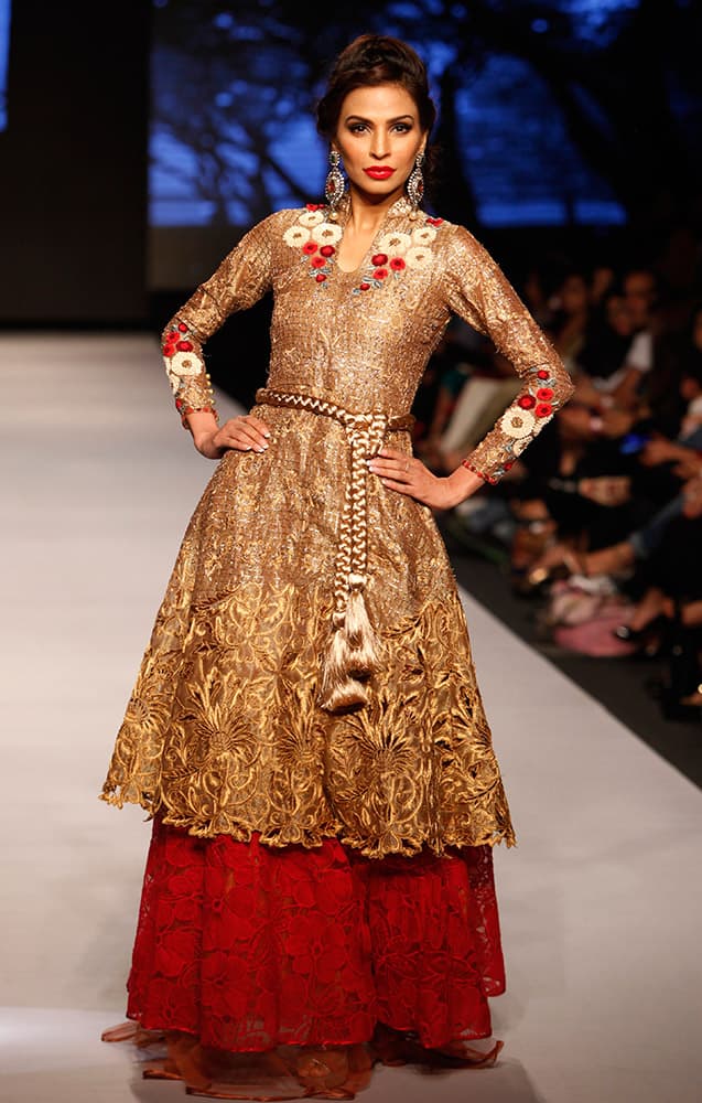 A model presents creations by Pakistani designer Sanam Chaudhri at Pakistan Fashion Week 2015, in Karachi, Pakistan.