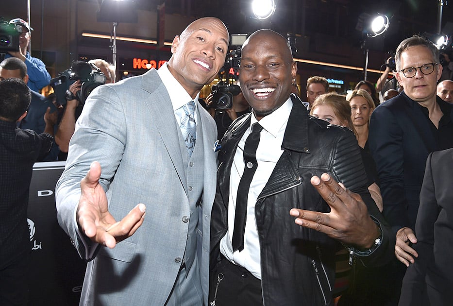 Dwayne Johnson and Tyrese Gibson arrive at the premiere of 'Furious 7' at the TCL Chinese Theatre IMAX, in Los Angeles.