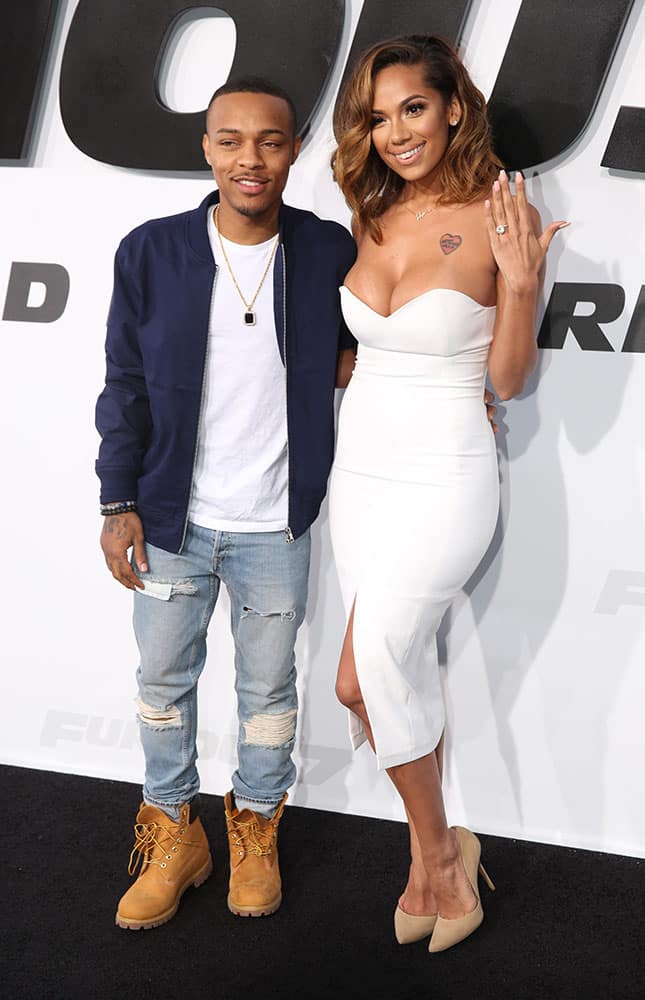 Shad Moss, left, and Erica Mena arrive at the premiere of 