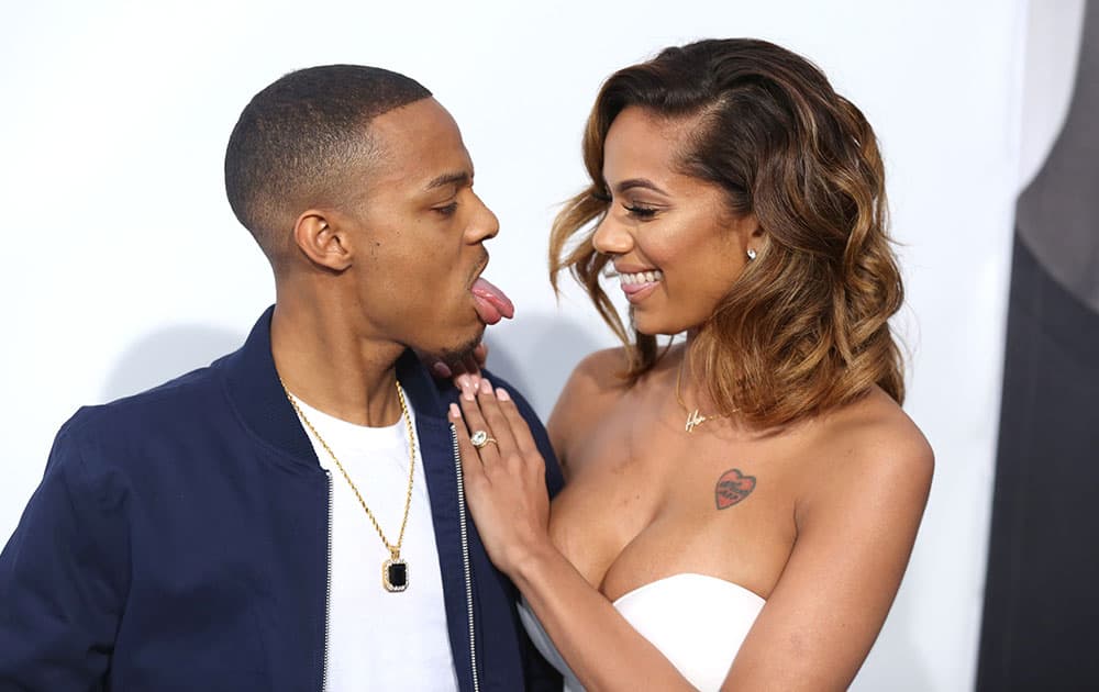 Shad Moss, left, and Erica Mena arrive at the premiere of 