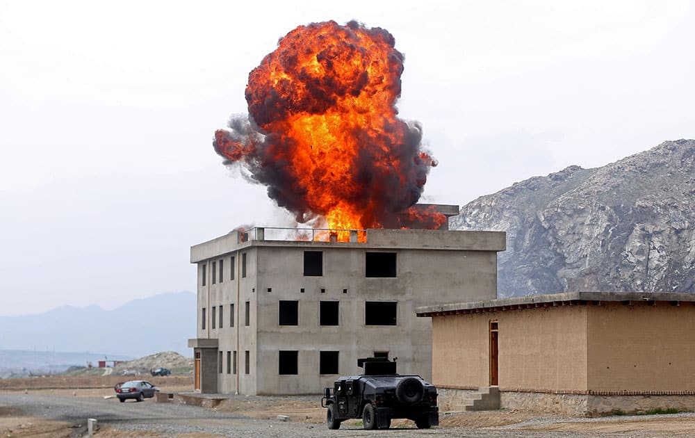 Smoke rises after an explosion during a military exercise in Kabul, Afghanistan.
