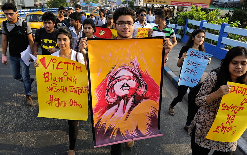 Students participate in a walk protesting violence against women in Kolkata.