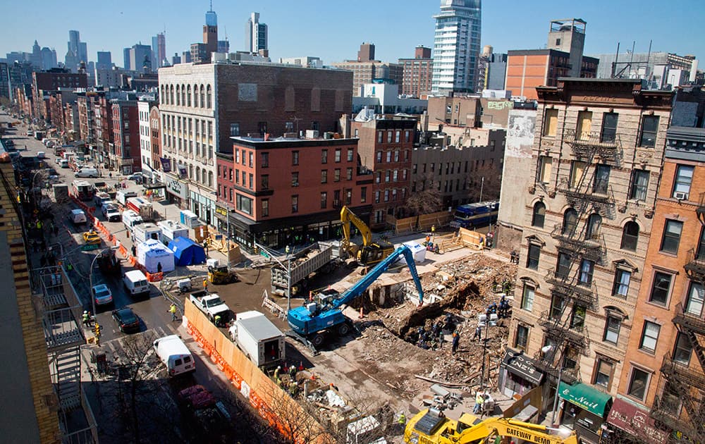 Investigators continue work, in a debris site remaining from a building explosion and ensuing fire that destroyed three buildings on March 26, in the East Village neighborhood in New York.