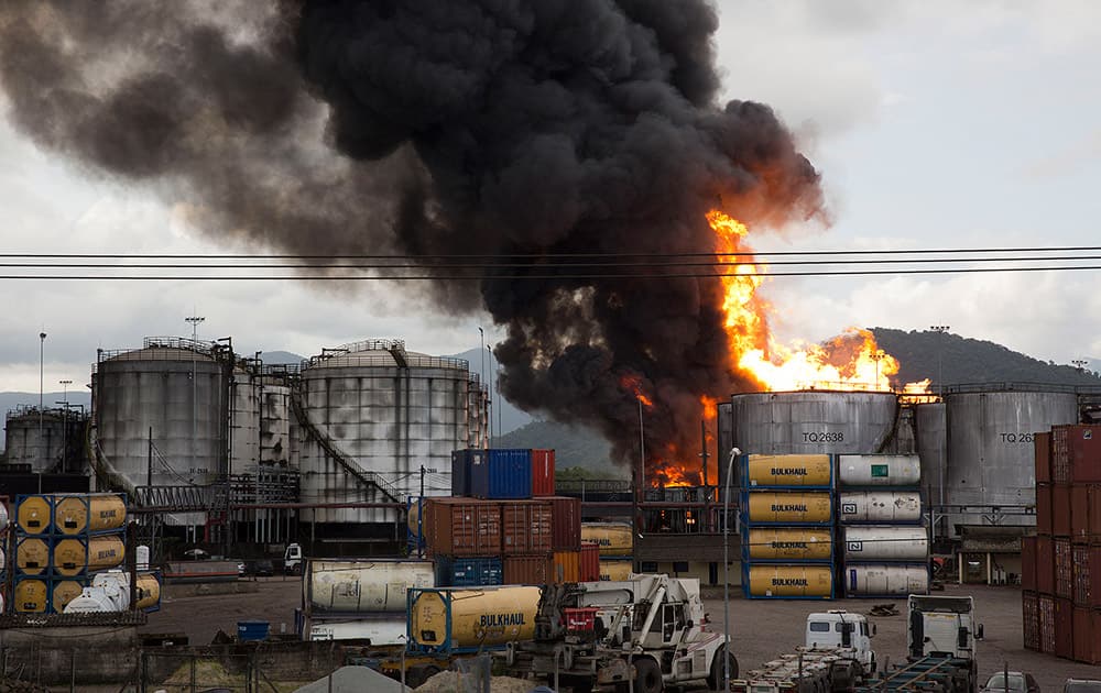 Smoke rises from a fire at a liquid bulk storage facility near Brazil's port of Santos.