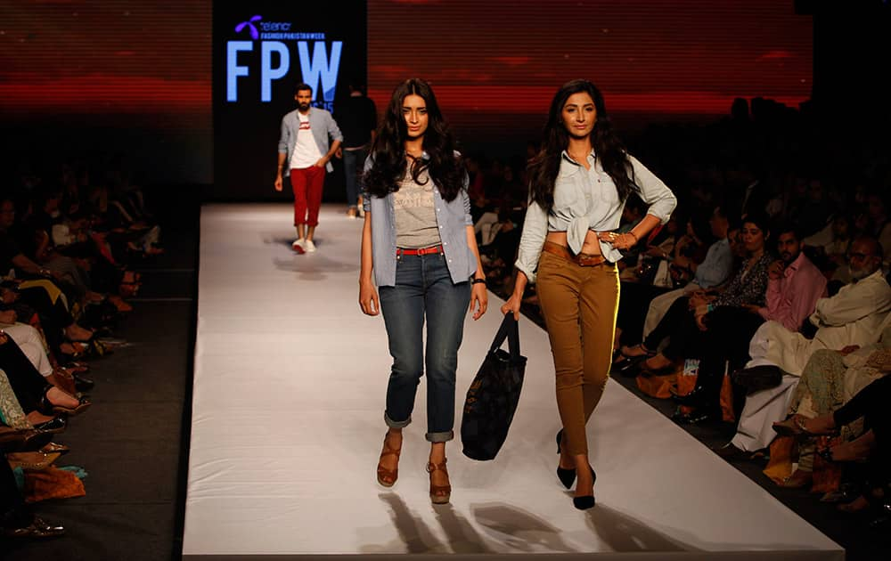 Models present creations by International label Levi's at Fashion Pakistan Week, Pakistan.