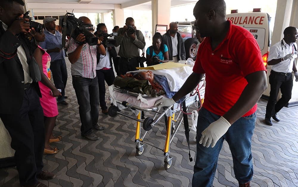 Medics help an injured person at Kenyatta National Hospital in Nairobi, Kenya.