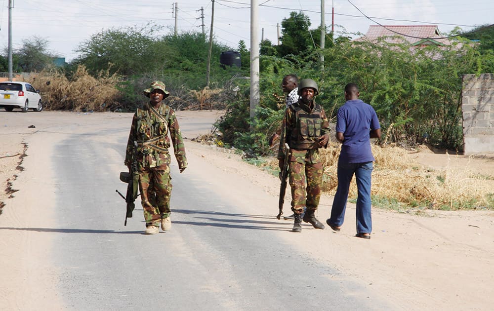 Members of Kenya's Defence Forces secure the area of the Garissa University college, in Garissa, Kenya. Witnesses say the gunmen who stormed a college in Kenya this morning identified themselves as members of al-Shabab, the Islamic extremist group from neighboring Somalia.