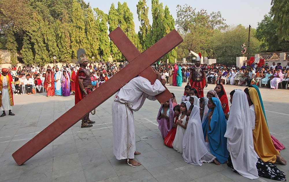 Christian devotees enact the crucifixion of Jesus Christ to mark Good Friday at Sacred Heart Church in Hyderabad