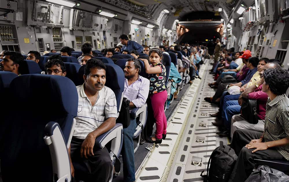 Indians evacuated from Yemen sit inside the Indian Air Force C17 Globemaster aircraft upon their arrival at Chhatrapati Shivaji International Airport in Mumbai.