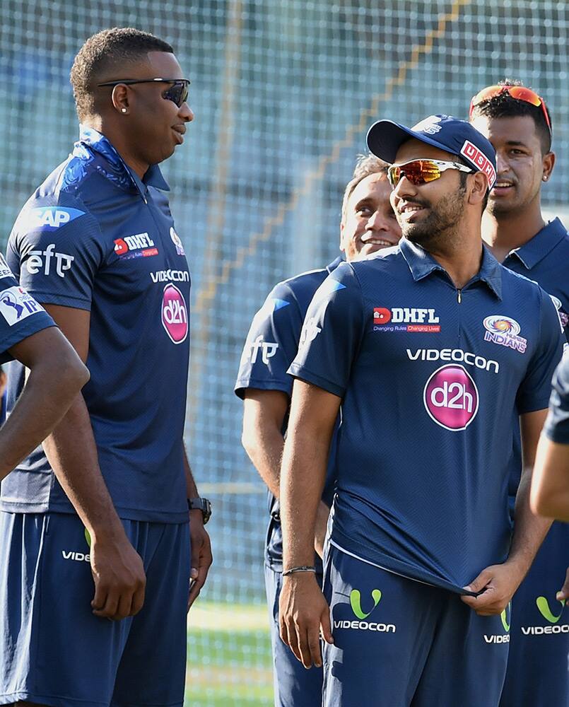 Mumbai Indians players Kieron Pollard and Rohit Sharma during a practice session in Mumbai.