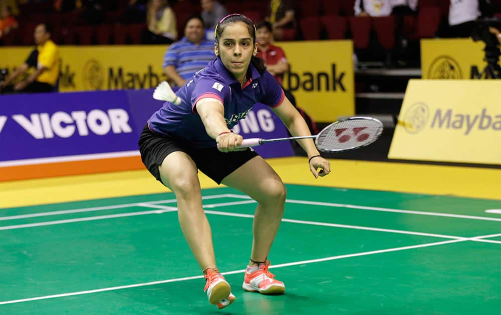 Saina Nehwal returns a shot to China's Sun Yu during their women's singles quarterfinal match at the Malaysia Open badminton tournament in Kuala Lumpur, Malaysia.