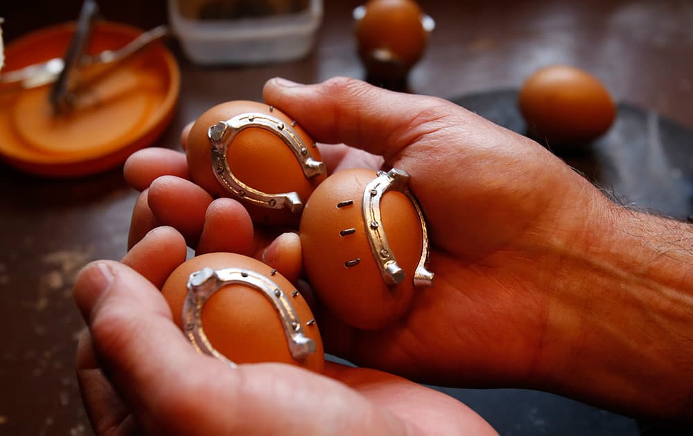 Bosnian Croat Stjepan Biletic holds eggs decorated with tiny horseshoes, in central Bosnian town of Kresevo, 60 kms south of Sarajevo.