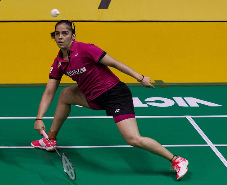 Saina Nehwal returns a shot to China's Li Xuerui during their women's singles semifinal match at the Malaysia Open badminton tournament in Kuala Lumpur.