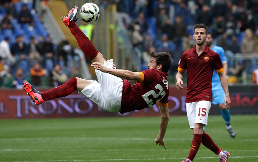 Roma's Davide Astori is airborne as he goes for an overhead kick during a Serie A soccer match between Roma and Napoli at Rome's Olympic stadium.