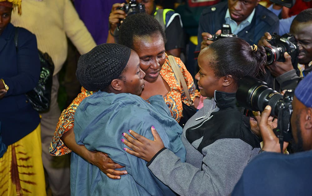 Relatives react together as some of the 663 students who survived the Garissa University College terror attack arrive in Nairobi Nyayo stadium, Kenya.