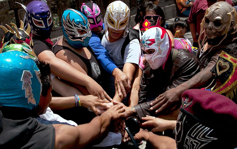 Independent 'lucha libre' wrestlers take part in a protest demanding health insurance policies that will cover them when injured in the ring, in Mexico City.