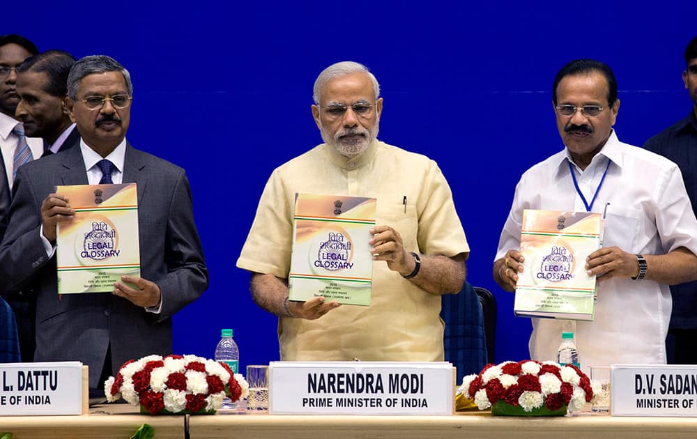 Chief Justice of India H.L. Dattu, Prime Minister Narendra Modi and Law minister D.V. Sadananda Gowda release Indian Legal Glossary during the Joint Conference of Chief Ministers and Chief Justices of High Courts, in New Delhi.