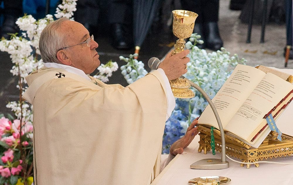 Pope Francis celebrates an Easter mass, in St. Peter's square at the Vatican.