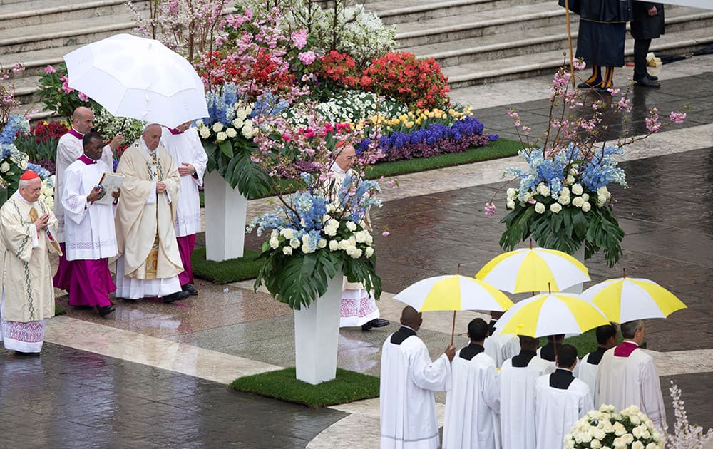 Pope Francis celebrates an Easter mass, in St. Peter's square at the Vatican.