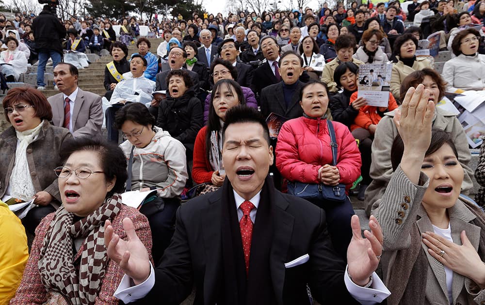 South Korean Christians pray during an annual Easter service rally at Yeonsei University in Seoul, South Korea.