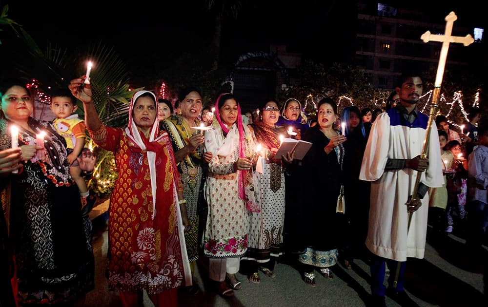 Pakistani Christians chant prayers during Easter service in Karachi.